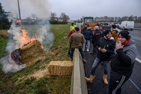 Farmers block a highway near Villefranche-de-Lolaguet on the outskirts of Toulouse