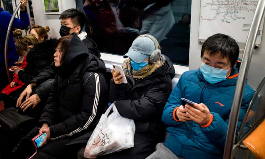 Subway passengers wear protective masks in Beijing