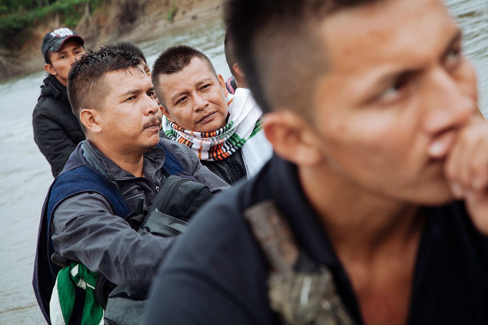 Mario, Sandro and members of Buenavista’s guardia travelling by motorised canoe on the River Putumayo. Photograph: Mateo Barriga Salazar