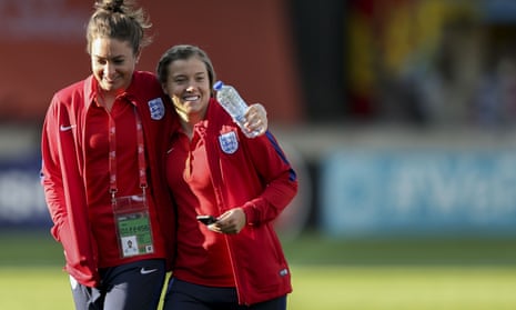 Jodie Taylor and Fran Kirby smile on the pitch before Lionesses' victory over France on Sunday
