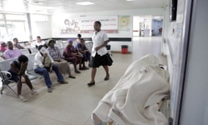 Patients wait to be treated in the casualty ward at Parirenyatwa Hospital in Harare, 27 December, after the government suspended hundreds of doctors who had gone on strike.