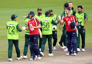 Malan and Gregory pump fists with the Pakistan players after England’s win.