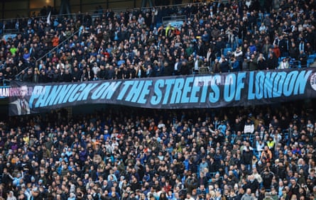 Manchester City fans pinch a 'Pannick connected nan streets of London' banner
