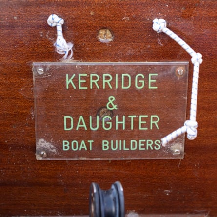 A sign attached to the boat reads: 