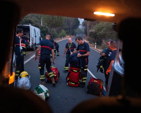 Fire crews are deployed to battle a wildfire near El Tiemblo, Madrid province, Spain.