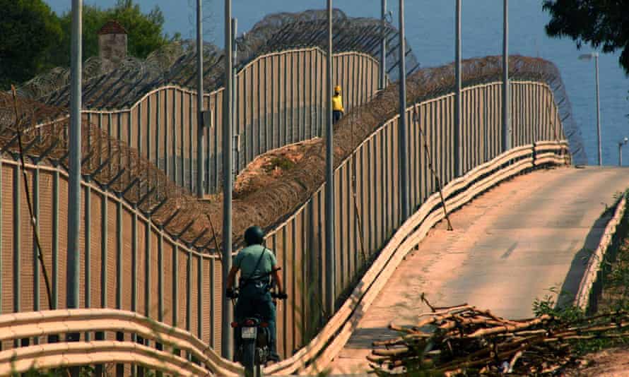 Spanish Civil Guard patrols the barrier which separates Melilla from Morocco