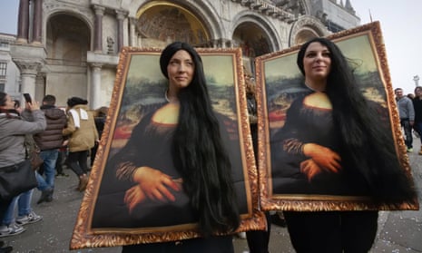 Reflecting ourselves: revellers masquerade as Leonardo da Vinci’s Mona Lisa in Venice.