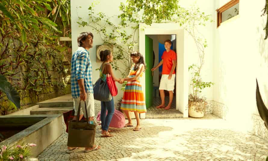 Airbnb hosts greet guests