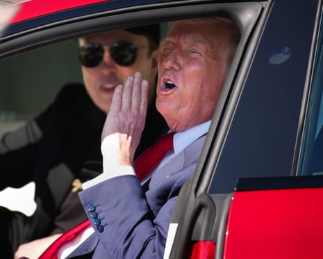 Trump and Musk in a red car