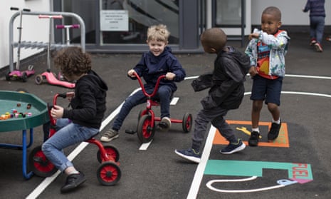Children play in a school in London