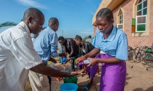 Coronavirus live news: Wuhan risk remains high, says party chief, as Trump blasts states 6 Parishoners wash hands as a preventive measure against the spred of the COVID-19 coronavirus on the last day of full gatherings as a parish at the Saint Don Bosco Catholic Parish in Lilongwe on March 22, 2020.