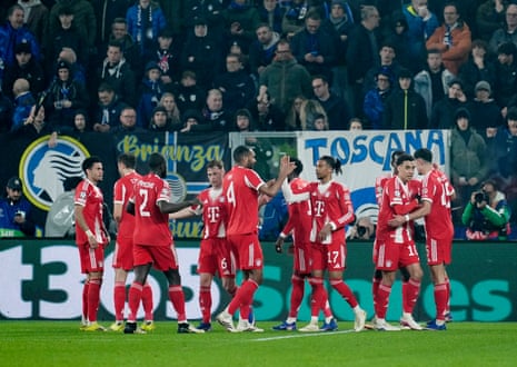 Bayern Munich's Michael Olise (number 17) celebrates scoring their fifth goal with teammates.