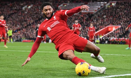 Joe Gomez slides to keep the ball in play against Arsenal