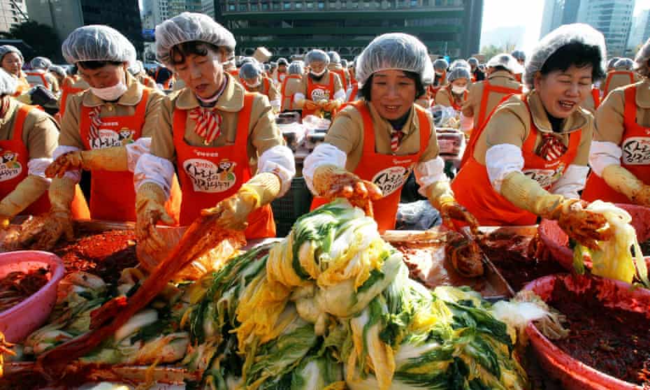 South Korean women prepare kimchi for charity in Seoul, 2012.