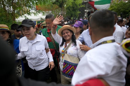 Aida Quilcué waves as people look on