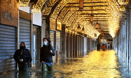 An arcade of shops and bars near St Mark’s Square is also inundated