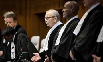 Members of the international court of justice stand in a line