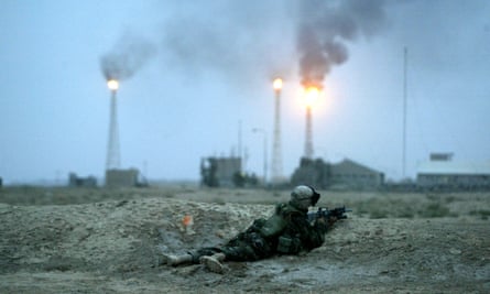 A marine takes fire near Basra’s main oil refinery on 21 March 2003.