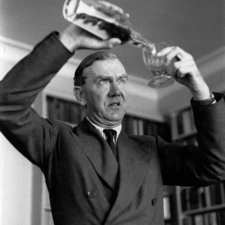 Graham Greene pours a drink.