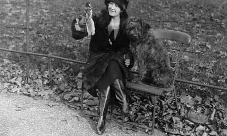Ivy Tresmand in Hyde Park, London, with her pet Russian wolfhound and parrot, wearing Russian boots, November 1925.