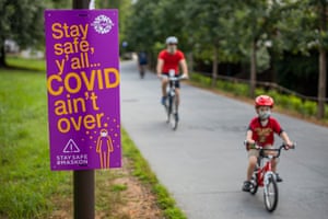 Safety information signs are seen along the Atlanta Beltline pedestrian and bike trail in Atlanta, Georgia.