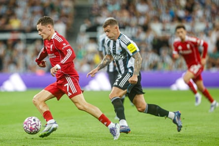 Newcastle’s Kieran Trippier tracks Liverpool’s Florian Wirtz.