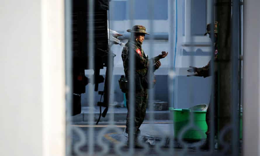 Myanmar soldiers are seen inside City Hall in Yangon