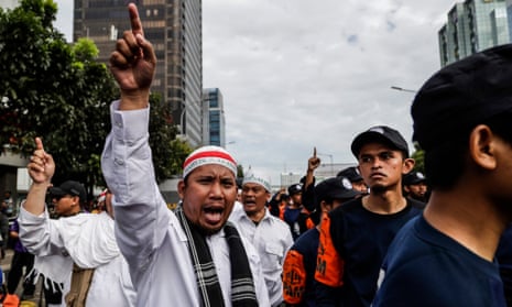 Muslim protesters shout slogans during a rally outside court during the blasphemy trial of Jakarta’s governor Basuki Tjahaja Purnama, popularly known as ‘Ahok’.
