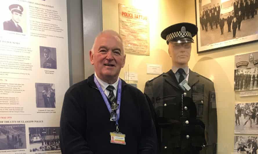 Curator and former officer Alastair Dinsmor with exhibits at Glasgow Police Museum.