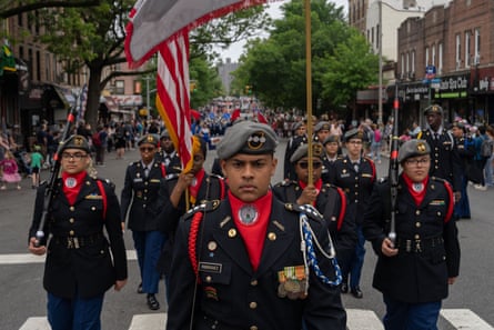 men in formation, wearing berets