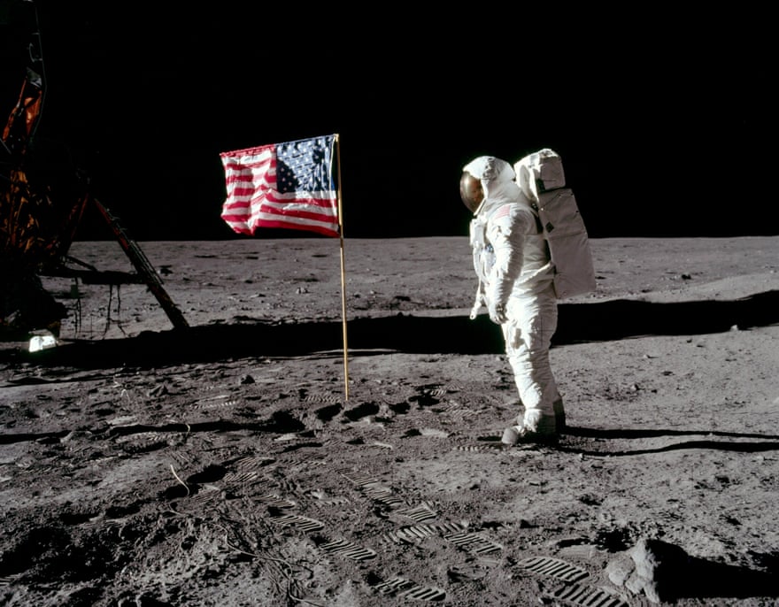 Aldrin poses next to the stars and stripes.