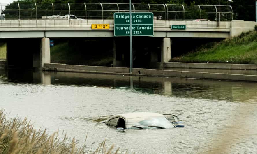 Submerged car on flooded road