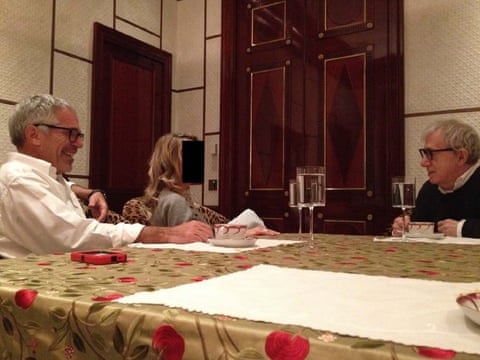 Jeffrey Epstein shares refreshments with actor and director Woody Allen and a woman with a redacted face