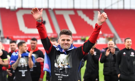 Oliver Norwood celebrates promotion to the Premier Leaguein May.