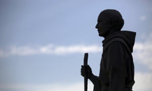 A statue of Friar Junipero Serra stands outside the Mission San Gabriel Arcangel in San Gabriel, California.