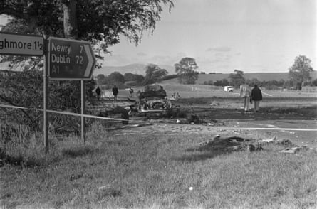 The scene of the Miami Showband killings, at Buskhill in County Down, Northern Ireland, with a roadsign pointing to a field with wreckage