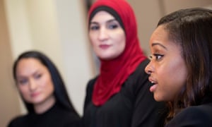 Tamika Mallory, right, co-chair of the Women’s March on Washington, talks alongside fellow co-chairs Carmen Perez, left, and Linda Sarsour, in New York.