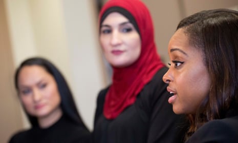 Tamika Mallory, right, co-chair of the Women’s March on Washington, talks alongside fellow co-chairs Carmen Perez, left, and Linda Sarsour, in New York. 
