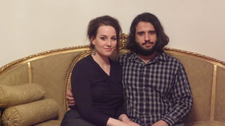 Wiese and Hashem sit together on a sofa