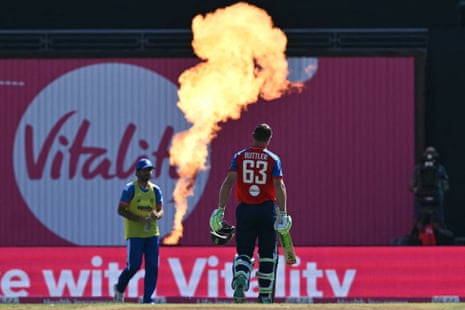 Jos Buttler reacts as he walks back to the pavilion after losing his wicket