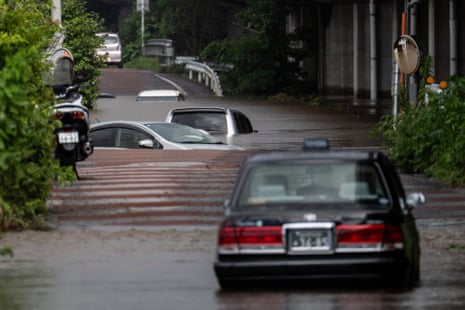 Abandoned cars on a flooded road