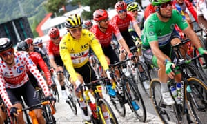 Tadej Pogacar in the yellow jerrsey sets off on stage nine.