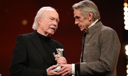 Actor Jeremy Irons (right) presents Jürgen Jürges with an award for DAU. Natasha at the Berlin film festival