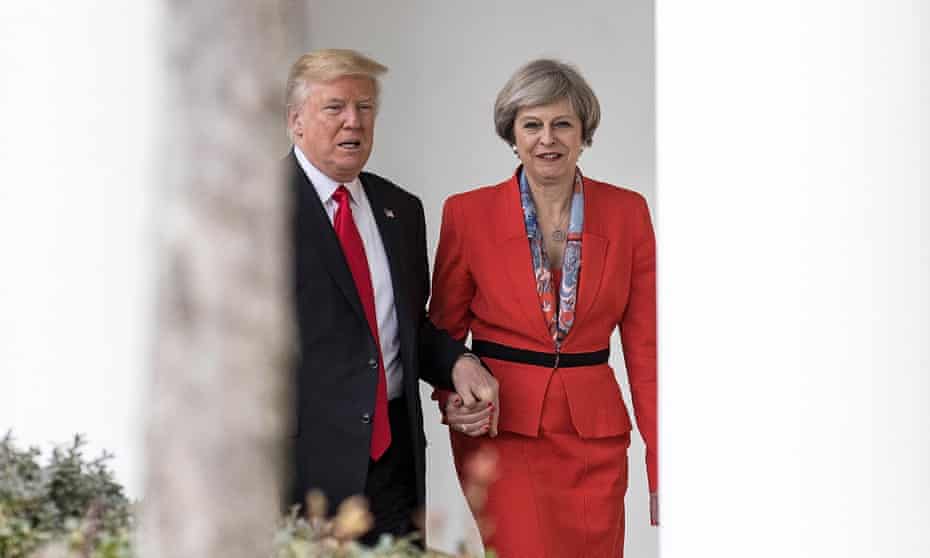 Trump and May hand in hand
