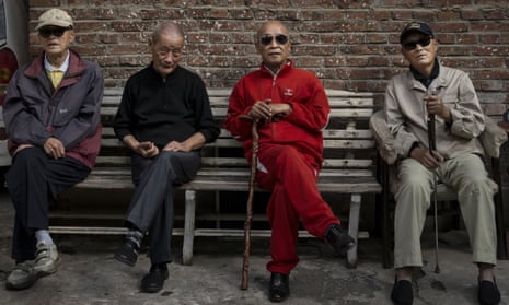 Row of old Chinese men on a bench