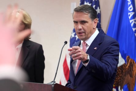 a man points to a person while speaking