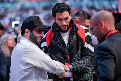 Saudi boxing supremo Turki al-Sheikh, left, English boxer Hamzah Sheeraz, center, meet with actor Jason Statham during the undercard bouts on Saturday at Wembley.