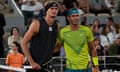 Alexander Zverev and Rafael Nadal pose for a picture at the net.