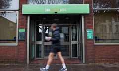 People passing by a job center in a London borough