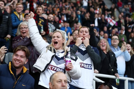 England fans celebrate after Jack Welsby of England scores their team's first try.